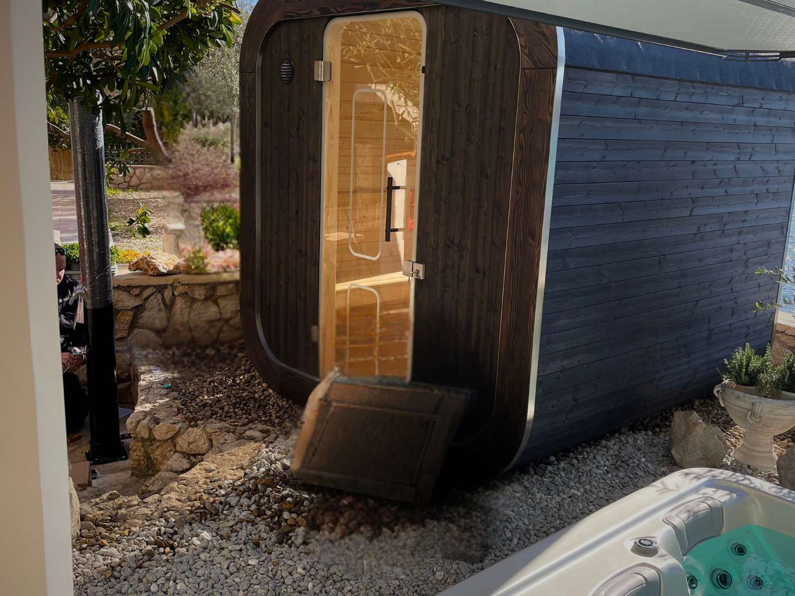 Installing an outdoor sauna in the garden from Dream Garden - professional installation of a sauna house