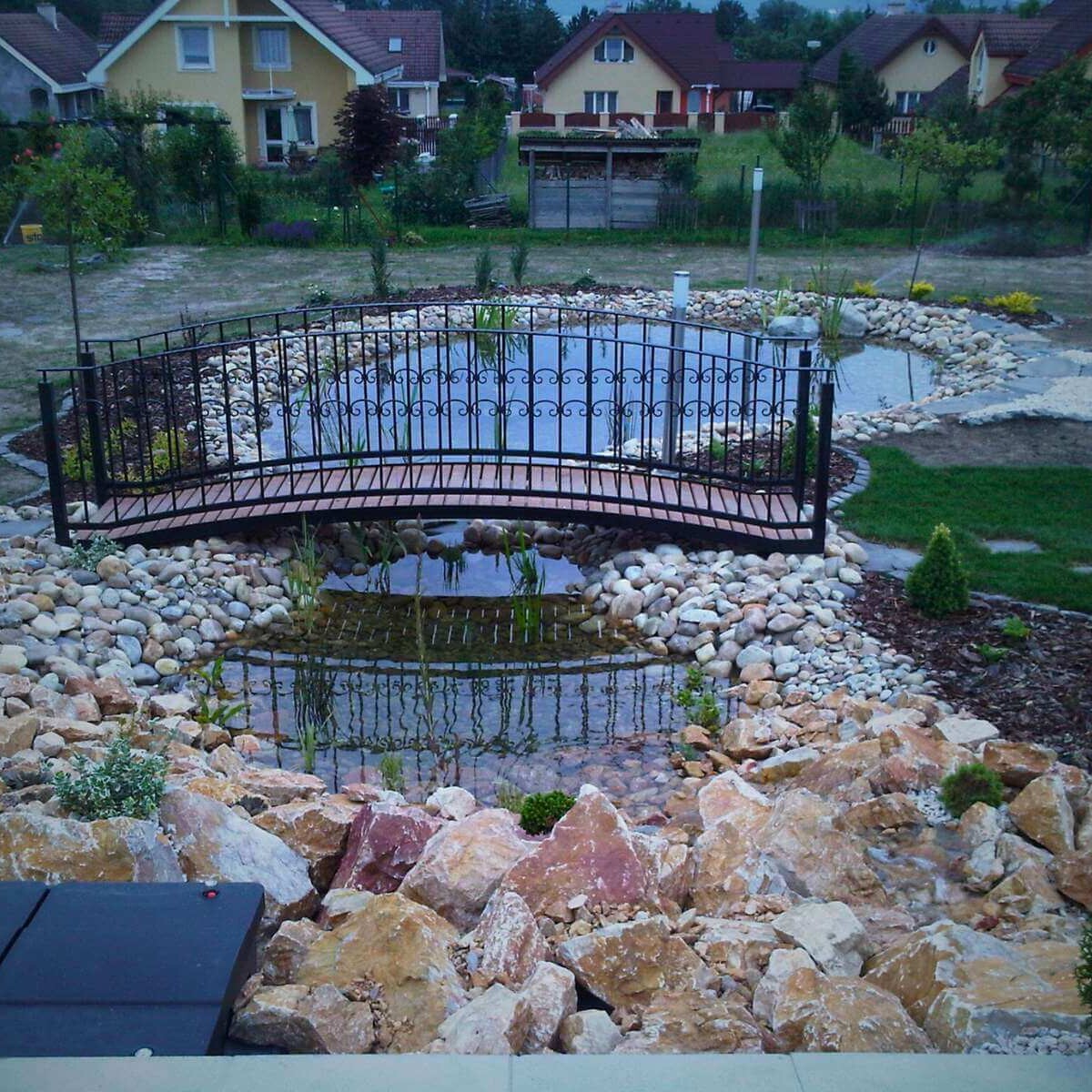 Iron bridge over a garden pond from Dream Garden