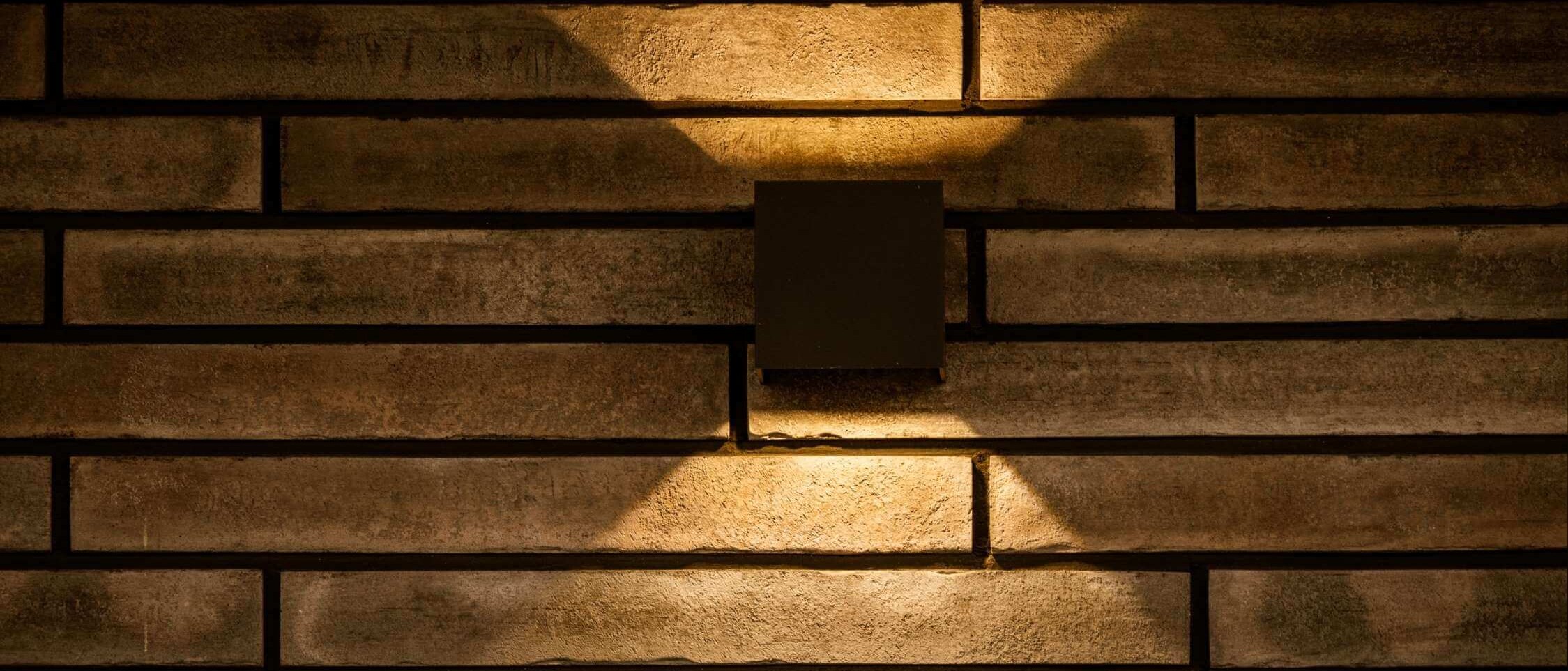 Modern LED lighting of the façade of a family house highlighting the architecture and creating a pleasant atmosphere of the exterior