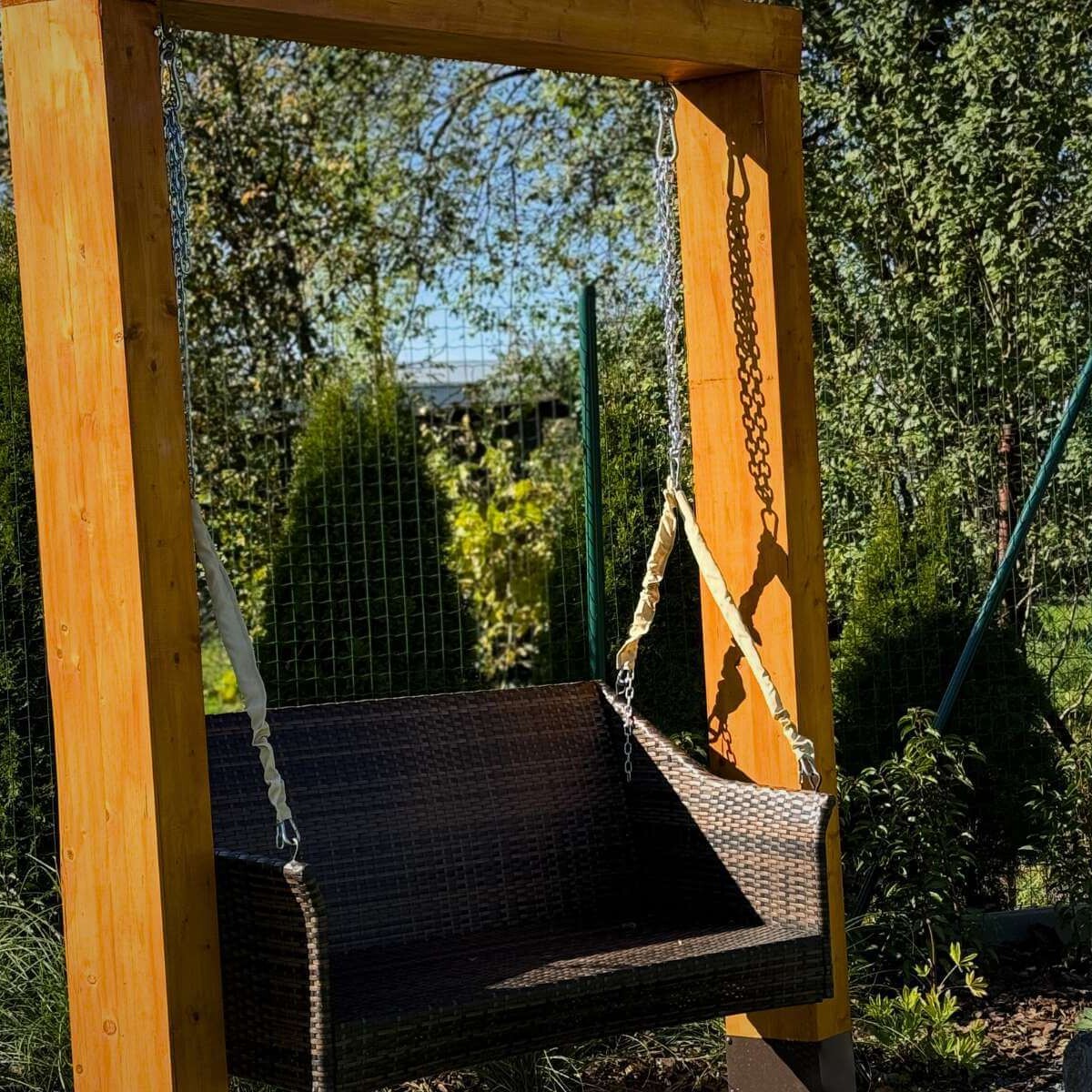 Stylish garden swing in a modern garden from Dream Garden - a comfortable place to relax and unwind outdoors