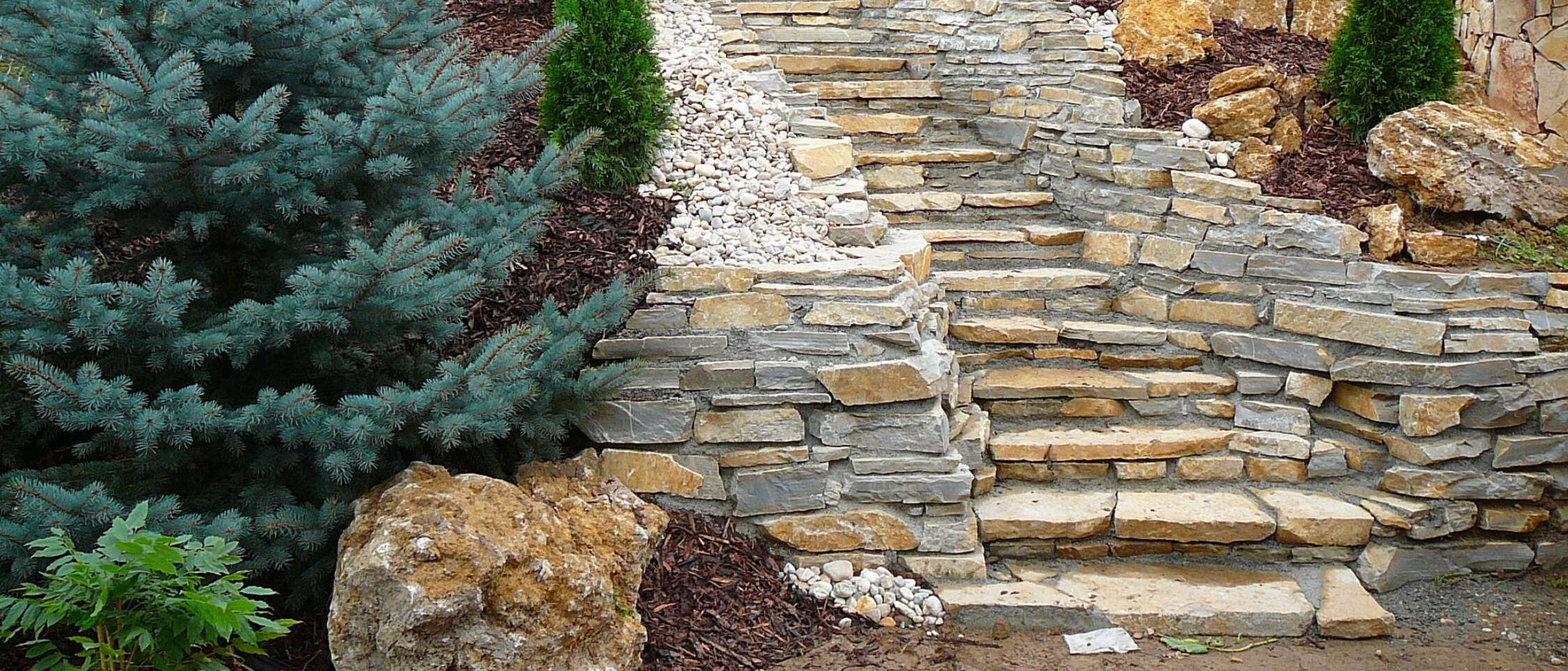 Adjustment and levelling of uneven terrain in the garden - terracing and stabilisation of slopes for better plant growth and exterior aesthetics